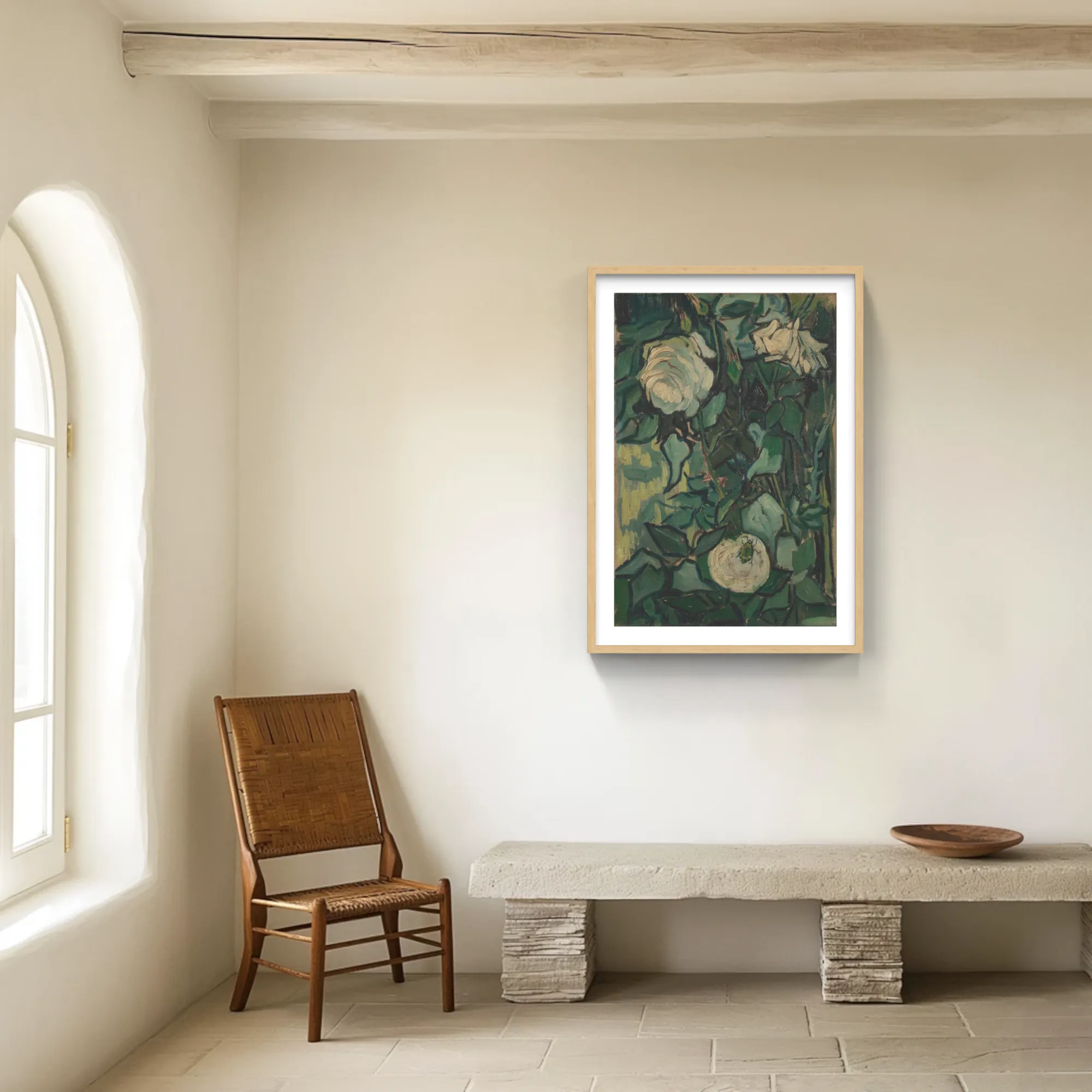 Van Gogh’s Roses in a natural wood frame with a white mat, hung above a stone bench in a plastered room